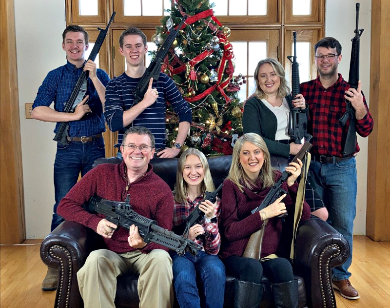 Senator's family at Christmas, everyone holding an AR-15