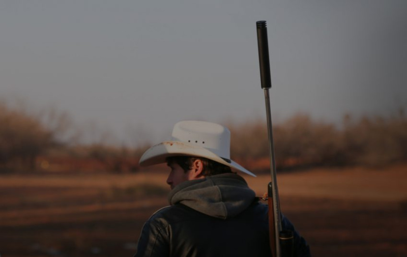 hunter with a silencer on rifle - why should i buy a silencer