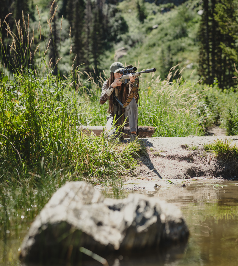 woman shooting suppressed rifle