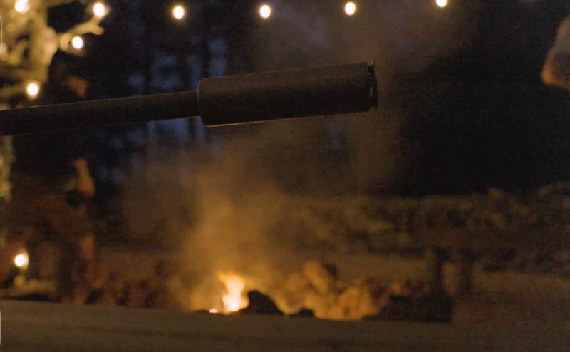 silencerco summer camp campfire with suppressor in foreground