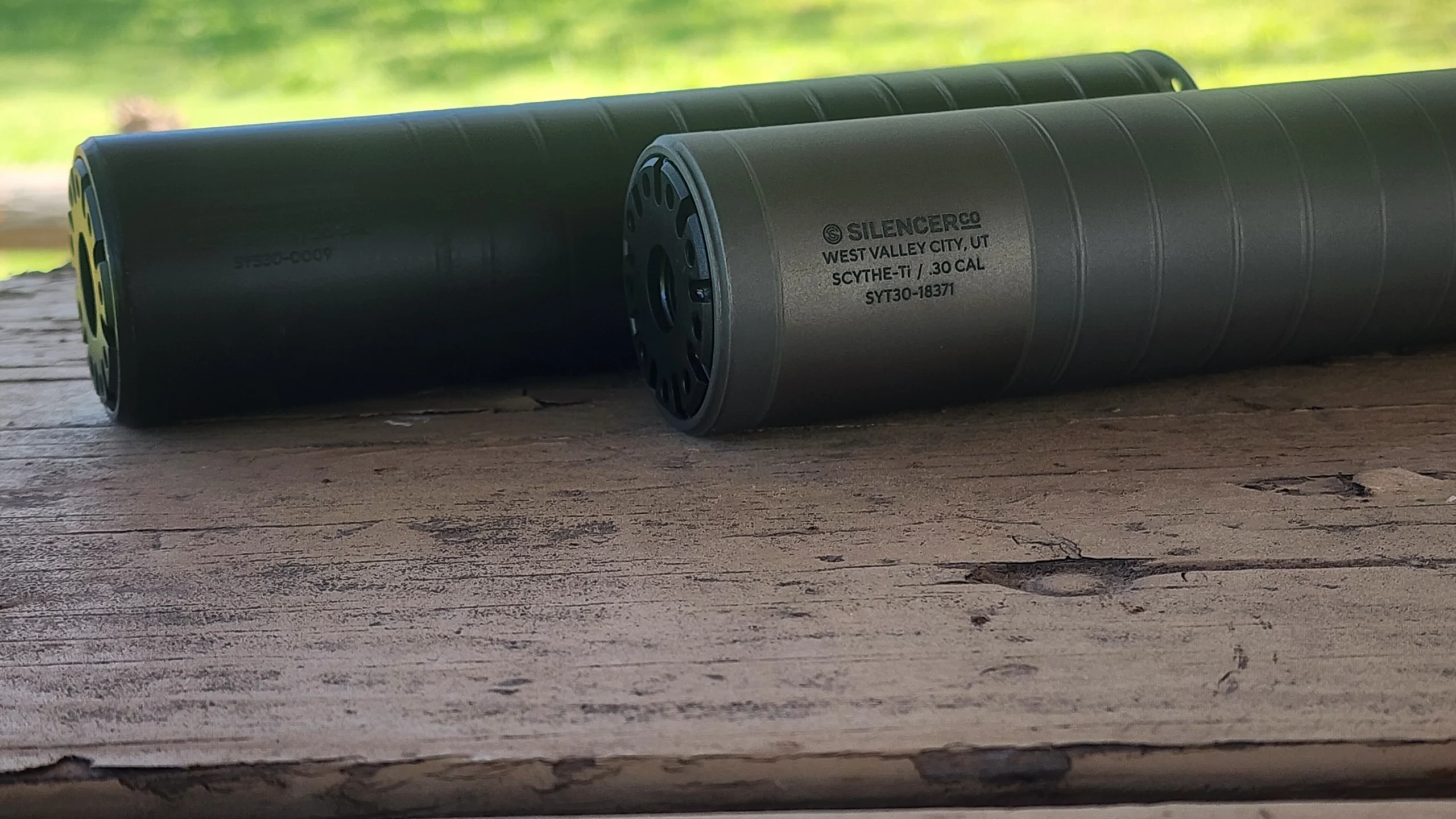 SilencerCo Scythe-Ti and SilencerCo Scythe STM next to each other to show the difference in finish