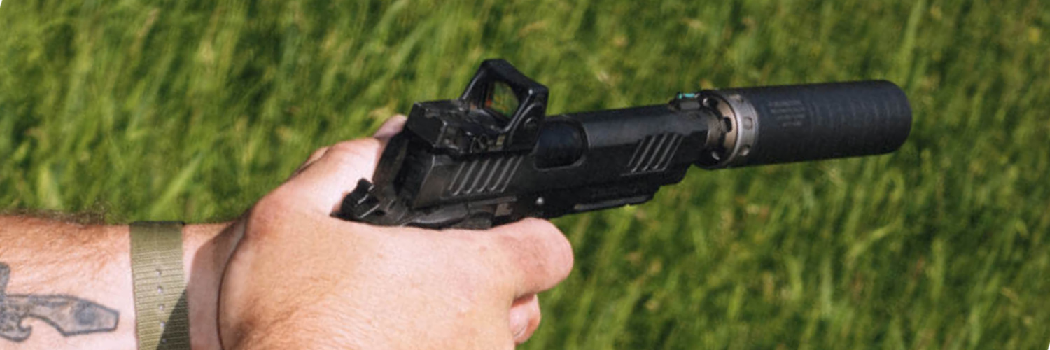 spectre 9 on pistol with a red dot sight