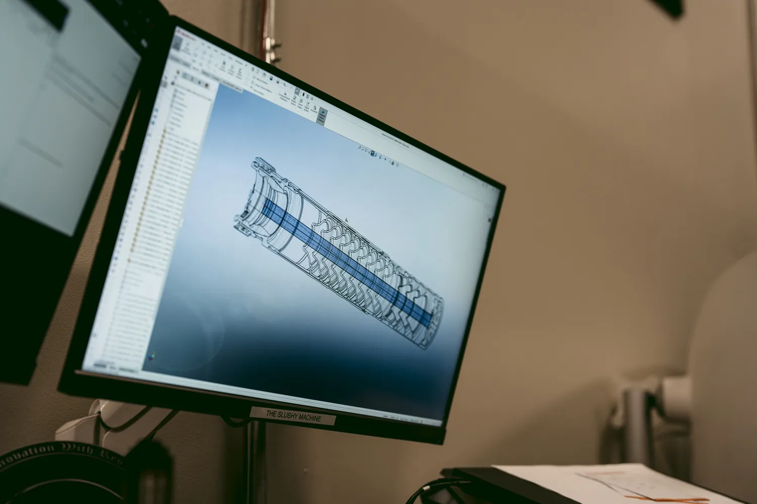 computer screen displaying CAD drawing of internal suppressor design - SilencerCo