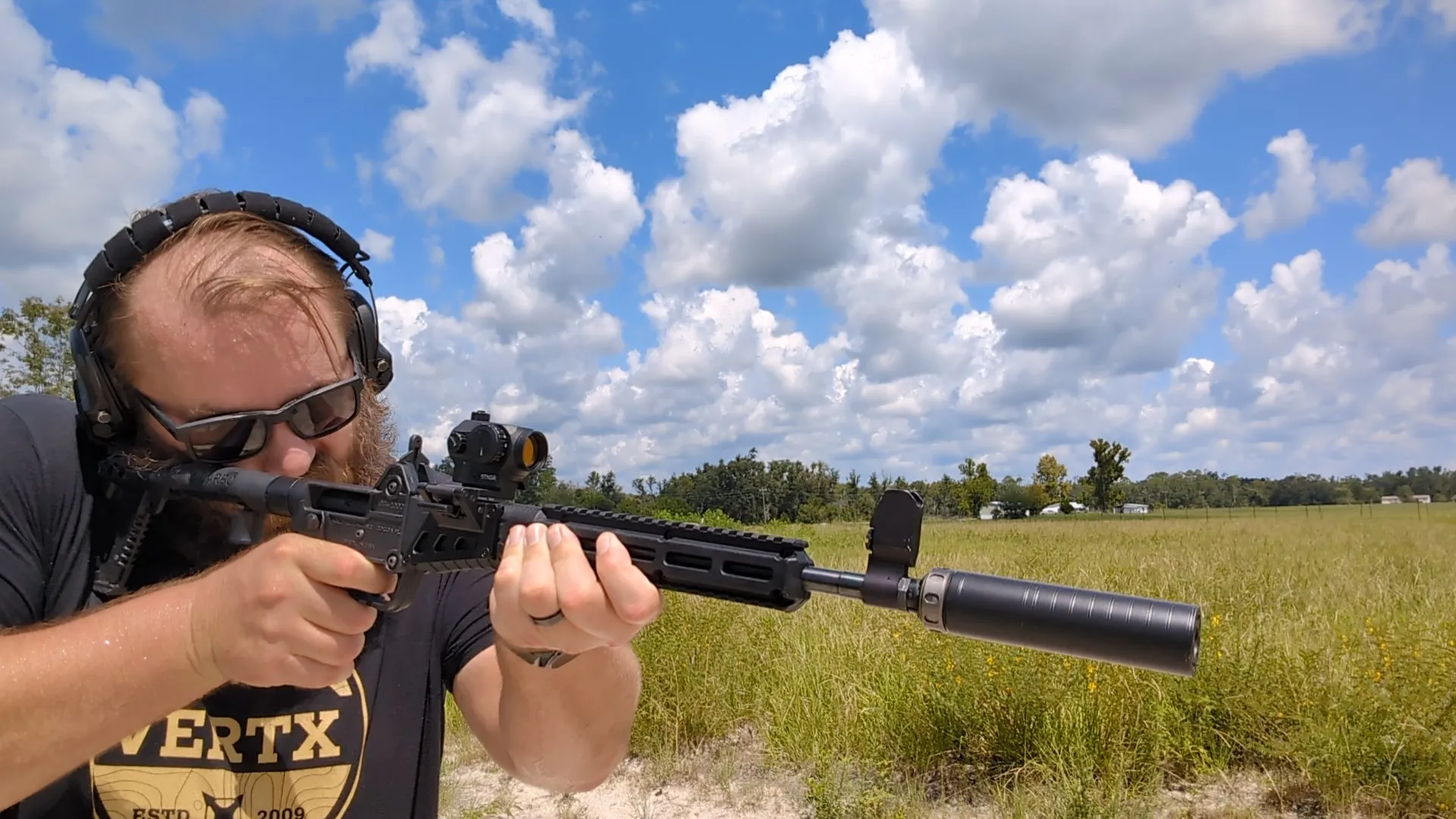 man shooting KelTec Gen 2 9mm SUB 2000 with SilencerCo Spectre 9 suppressor