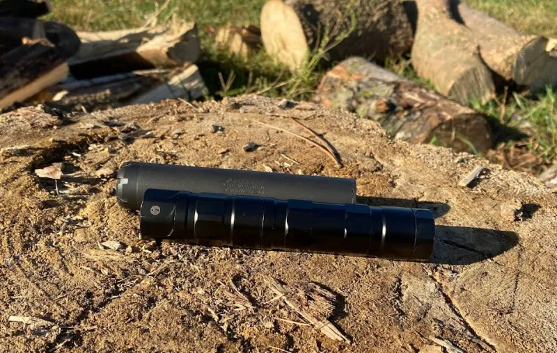 SilencerCo Switchback 22 and Sparrow 22 rimfire suppressors on wood block