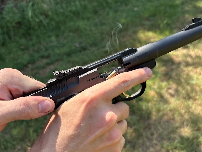 manual cycle of rimfire pistol with suppressor with subsonic ammo